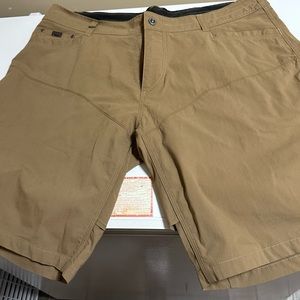 A New Pair of Men’s Kuhl Shorts, Size Waist 42”, Color Dark Tan